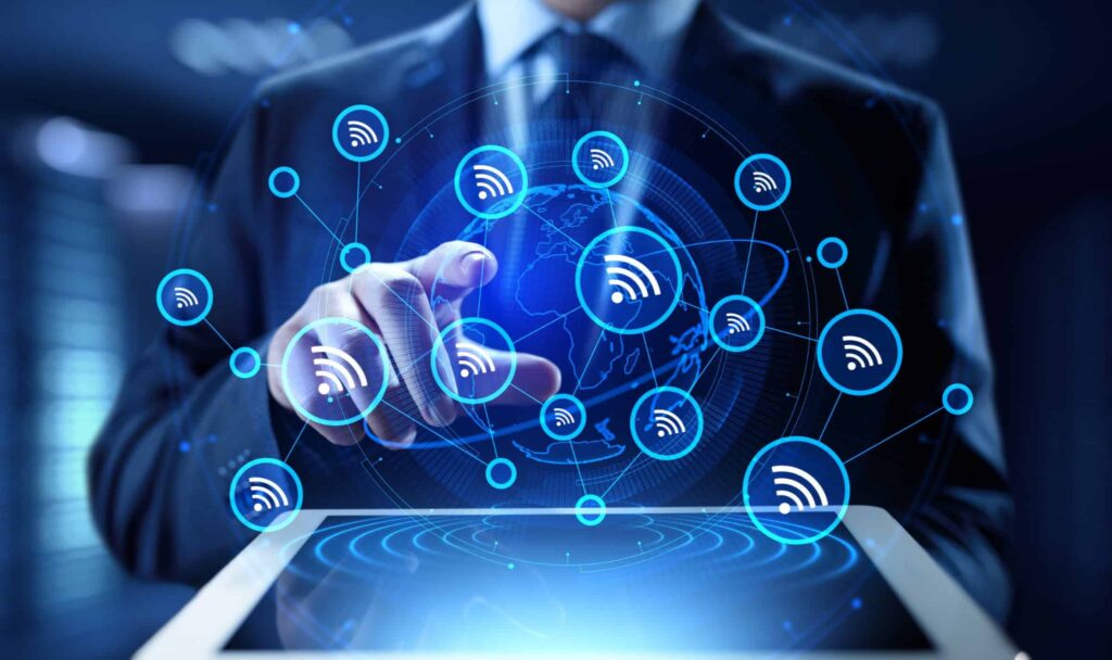 Business professional interacting with digital icons representing internet connectivity and wireless network signals, with a tablet and global map in the background. Looking for internet access in their area.